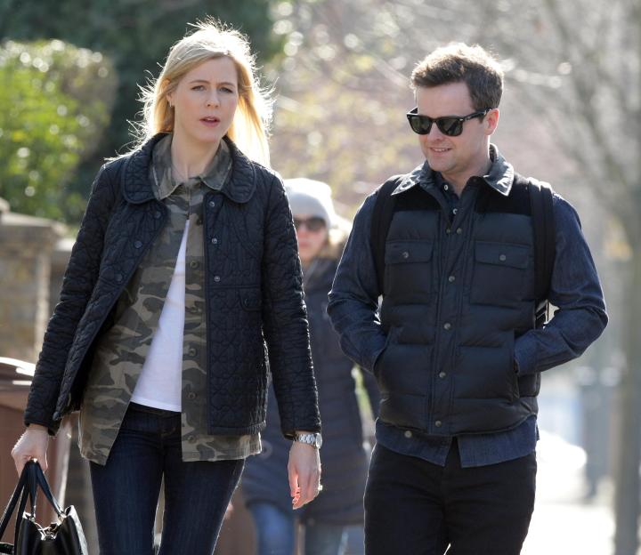 Declan Donnelly and Ali Astall walking together on a sunny day.