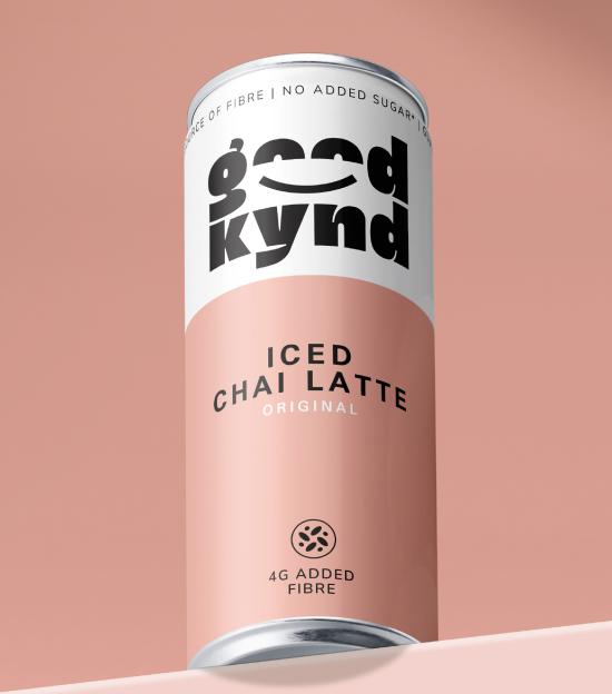 Good Kynd Iced Chai Latte Original can, with 4g added fibre, on a light pink surface.