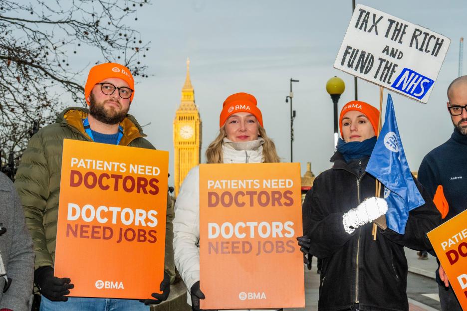 London, UK. 17th Dec, 2025. Placards include one which says - Tax the Rich, Fund the NHS - Resident doctors in England strike picket Line at St Thomas' Hospital, London. They are going ahead with a second round of industrial action after failed talks