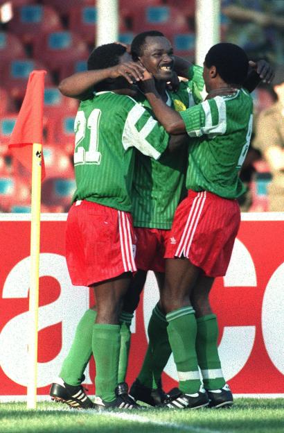 Cameroon's forward Roger Milla (C) celeb