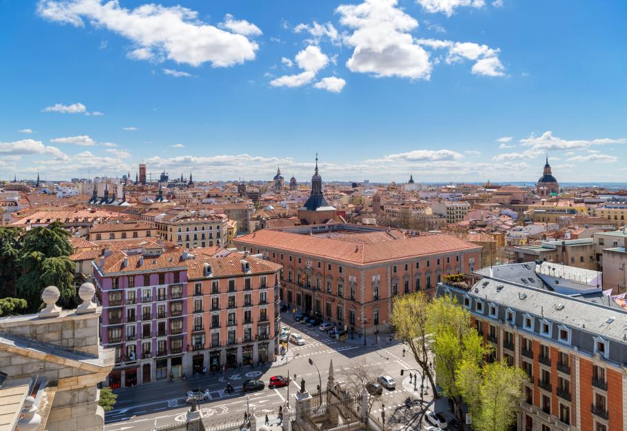 An aerial view of Madrid's cityscape from the Cathedral rooftop on a sunny day.