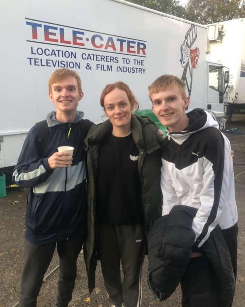 Oscar and brother Jake Parry with an actress on the set of Corrie.