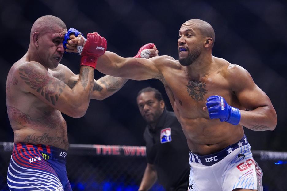 UFC fighters Alex Pereira and Ciryl Gane exchanging punches in a UFC fight.