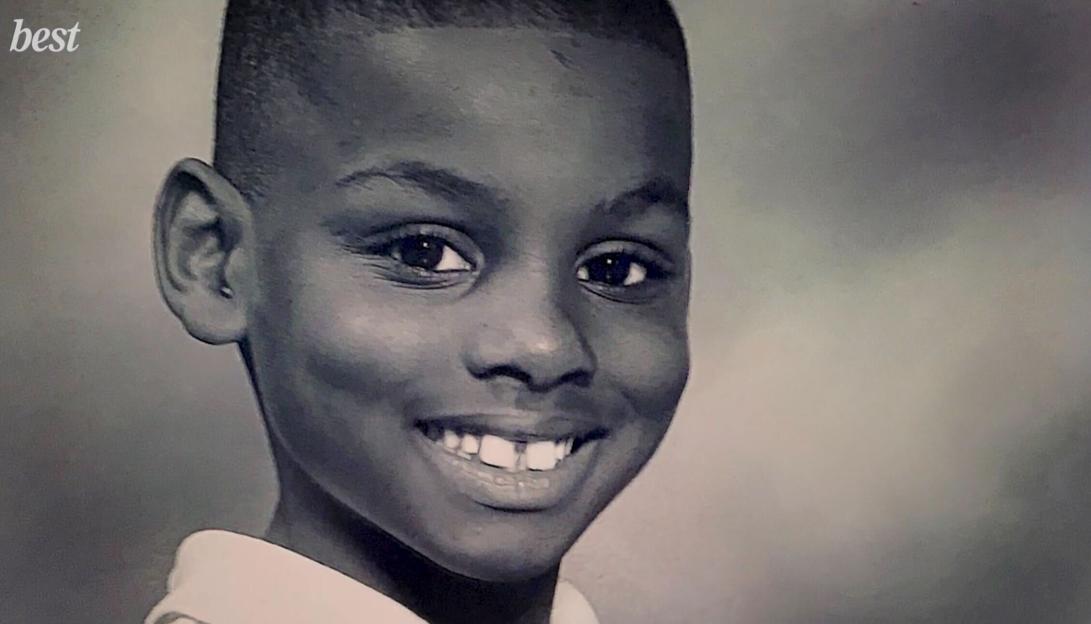 Black and white photo of a smiling young boy, Sherrell Dillion.