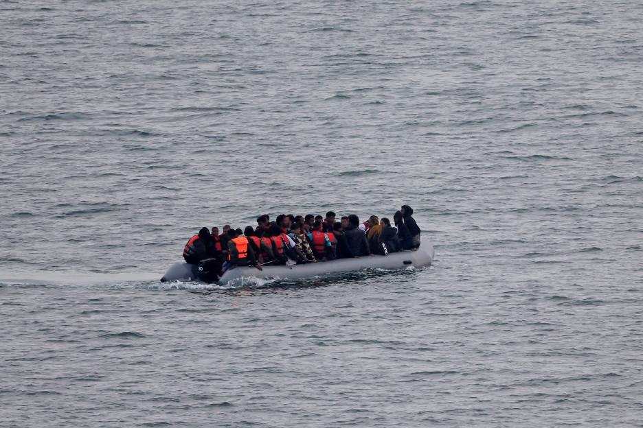 A group of migrants on an inflatable dinghy in the English Channel.