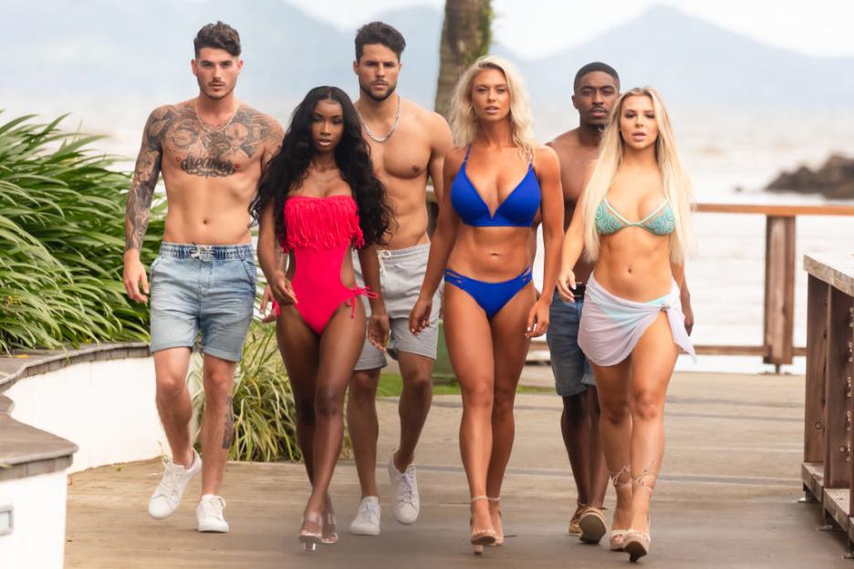 Eric Hall, Aissata Diallo, George Johnson, Kelsey Jenkins, Ray Gantt, and Marlisse "Marli" Tyndall from Love Island walking outdoors.