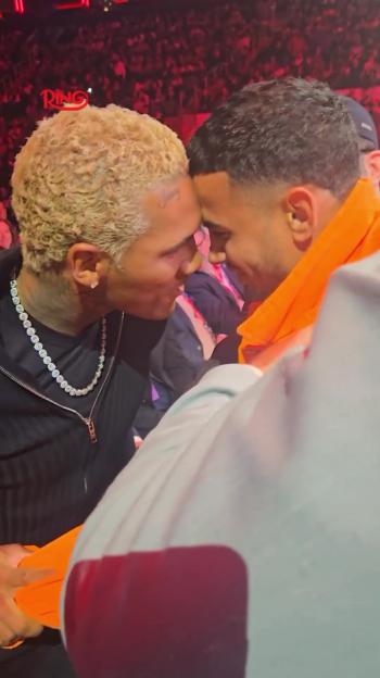 Rolly Romero and Conor Benn face off at ringside.