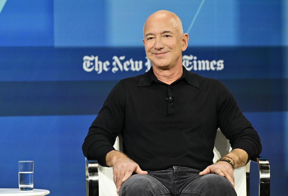 Jeff Bezos smiles while speaking at The New York Times Dealbook Summit 2024.
