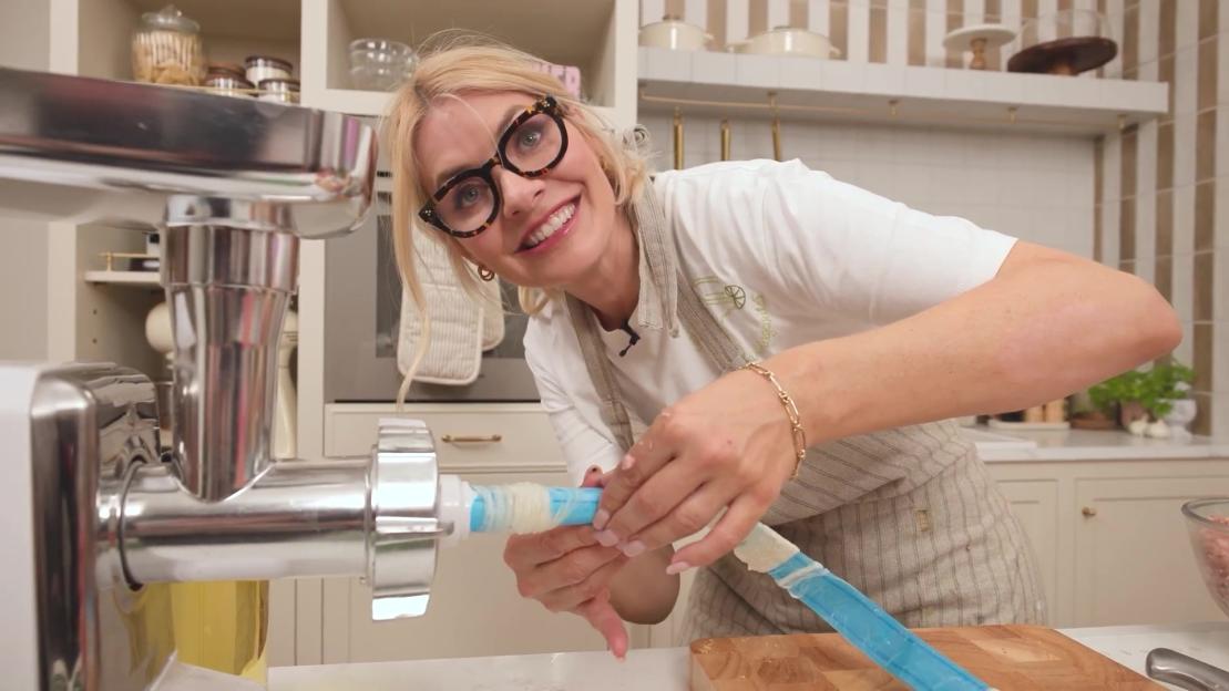 Holly Willoughby uses a sausage stuffer to make sausages.