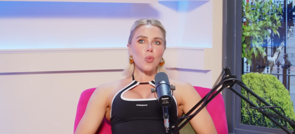 Gabby Allen from Love Island speaking into a microphone.