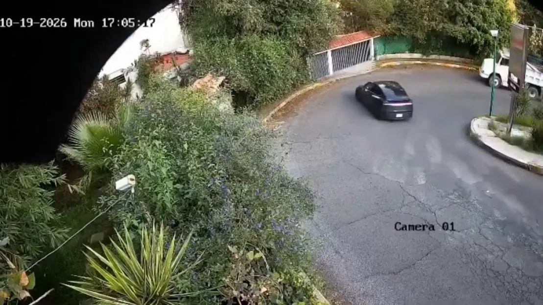 Terrifying moment speeding Tesla flies off ledge and plummets to ground after smashing through wall