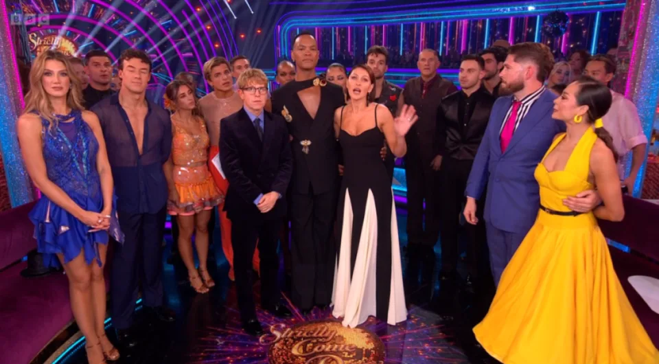 The contestants and professional dancers of Strictly Come Dancing stand on stage together.