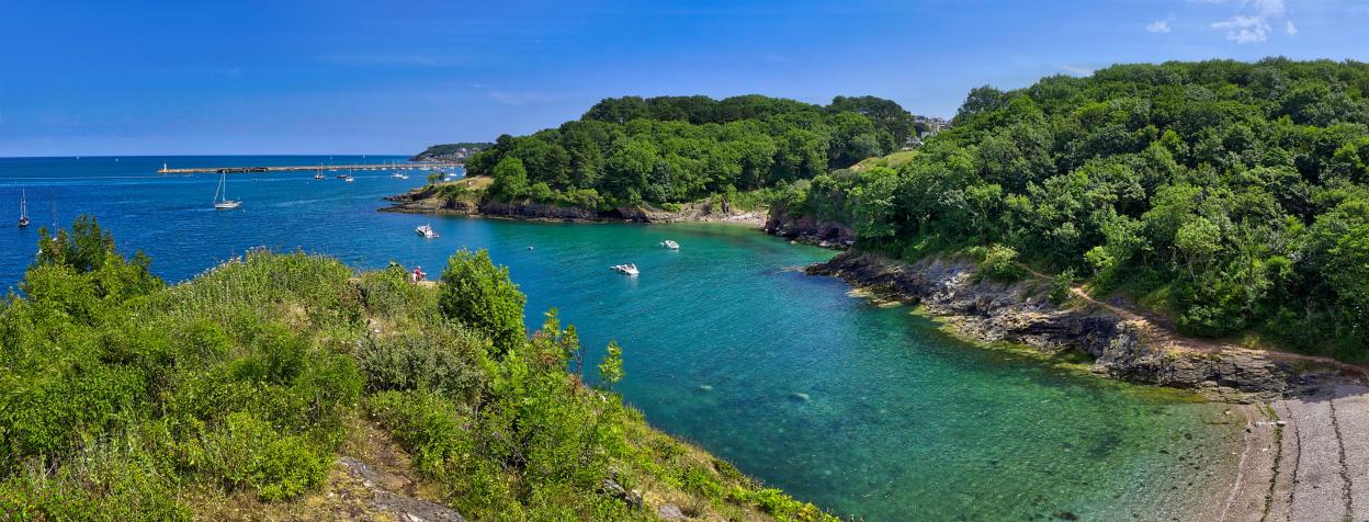 Fishcombe Cove with Brixham Breakwater Lighthouse in the background.