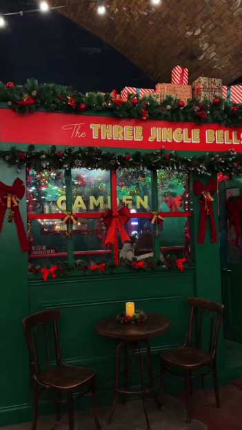 Christmas decorated exterior of "The Three Jingle Bells" pub.