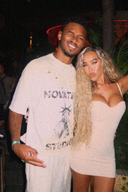A man and woman posing for a photo.