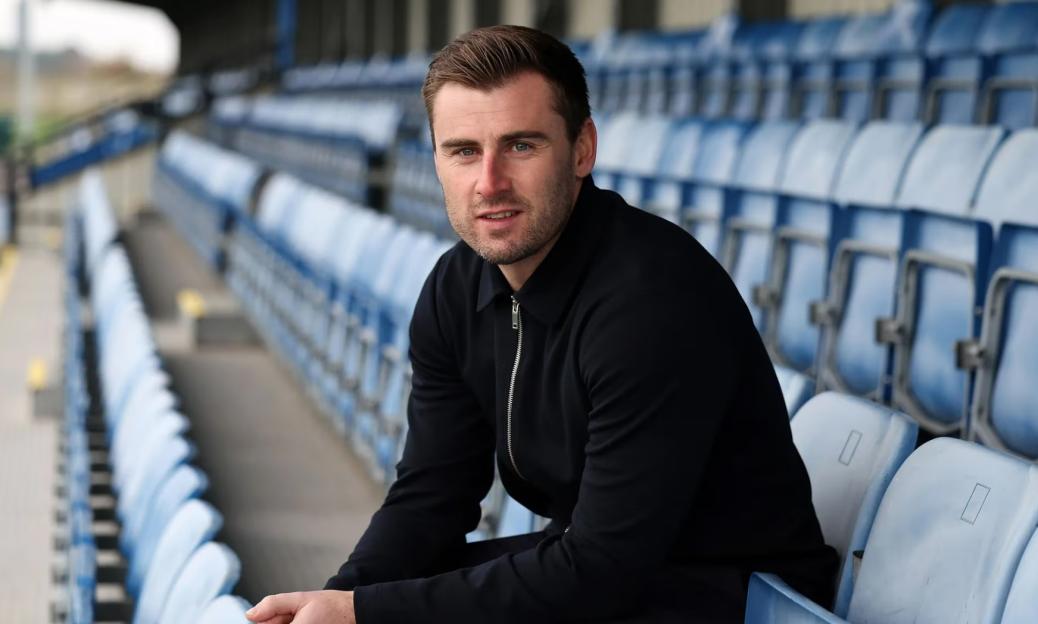 Sam Jewell, Brighton’s head of recruitment, sits in the stands of a stadium.