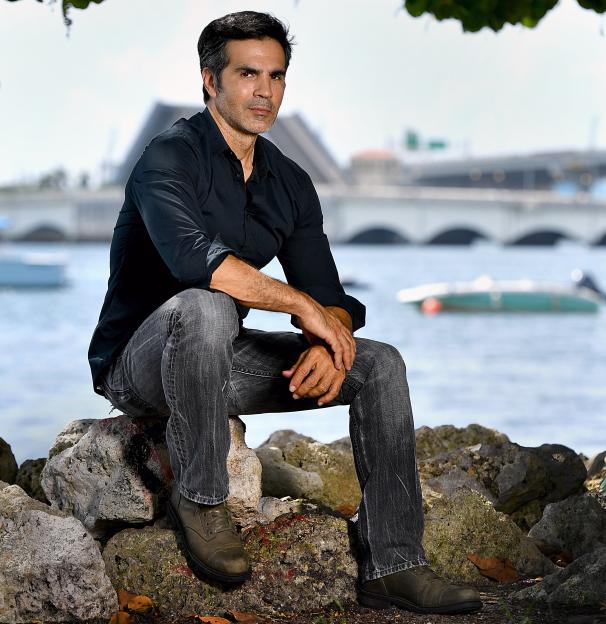Ojani Noa, Jennifer Lopez's ex-husband, sits on rocks near the waterfront in downtown Miami.
