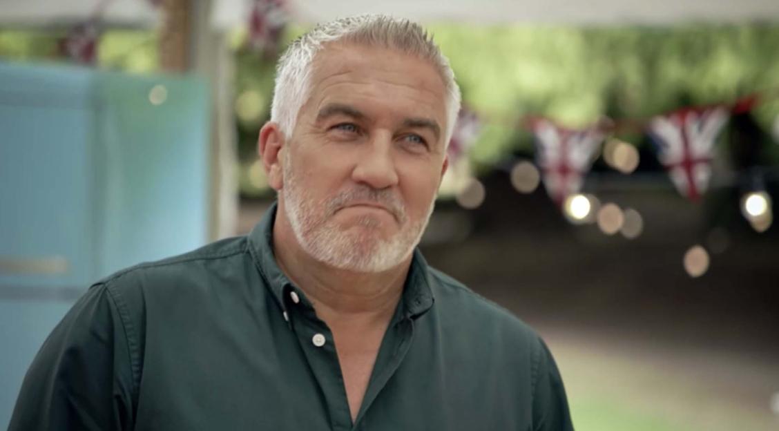 Paul Hollywood from Bake Off with a subtle smirk on his face.