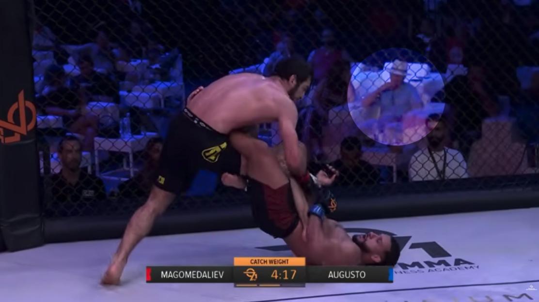 Christy Kinahan watching a cage fighting match in Dubai.