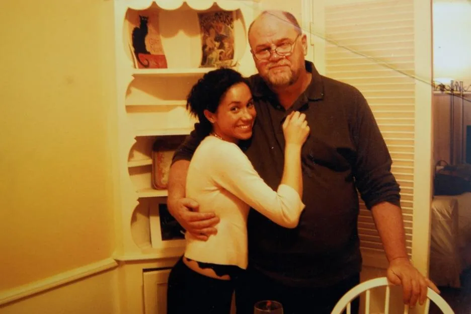 Photograph of Thomas Markle and Meghan Markle embracing indoors.