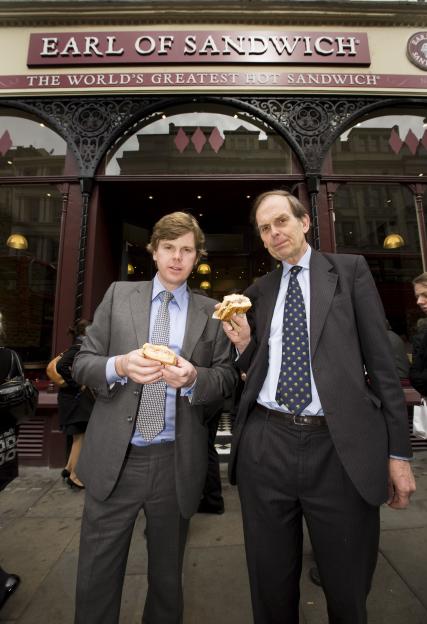 John Montagu, 11th Earl of Sandwich, and his son, Orlando Montagu, outside their "Earl of Sandwich" shop.
