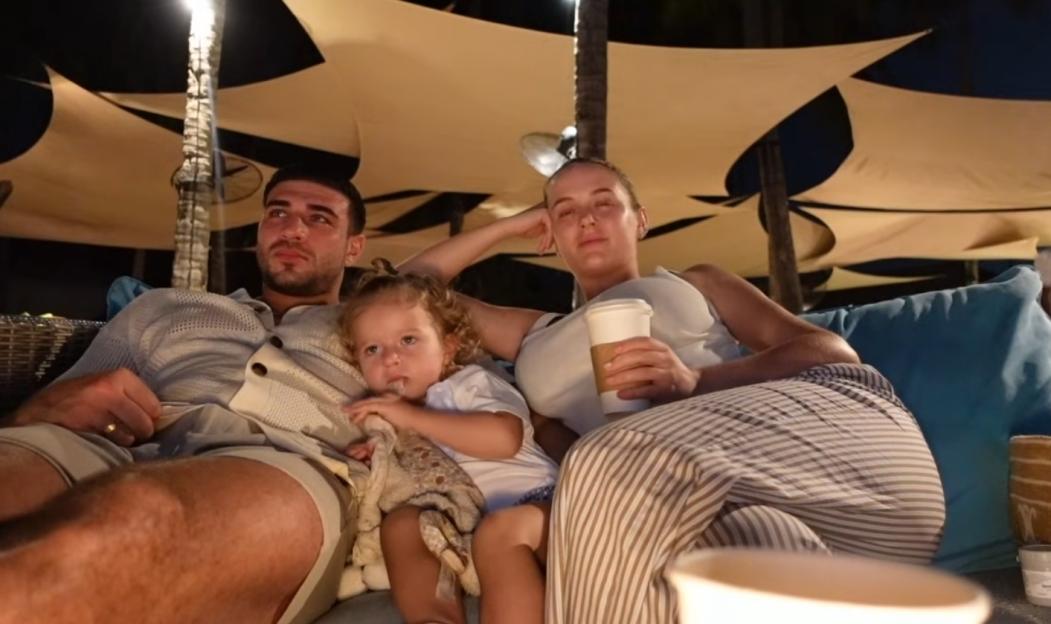 The family enjoyed cosying up to each other as they watched some beach cinema