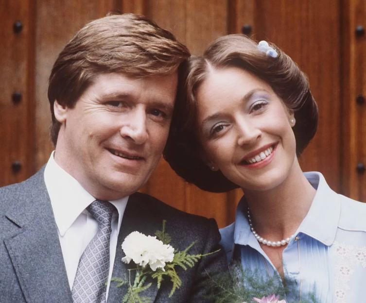 Ken Barlow and Deirdre Langton smiling at their wedding on "Coronation Street."