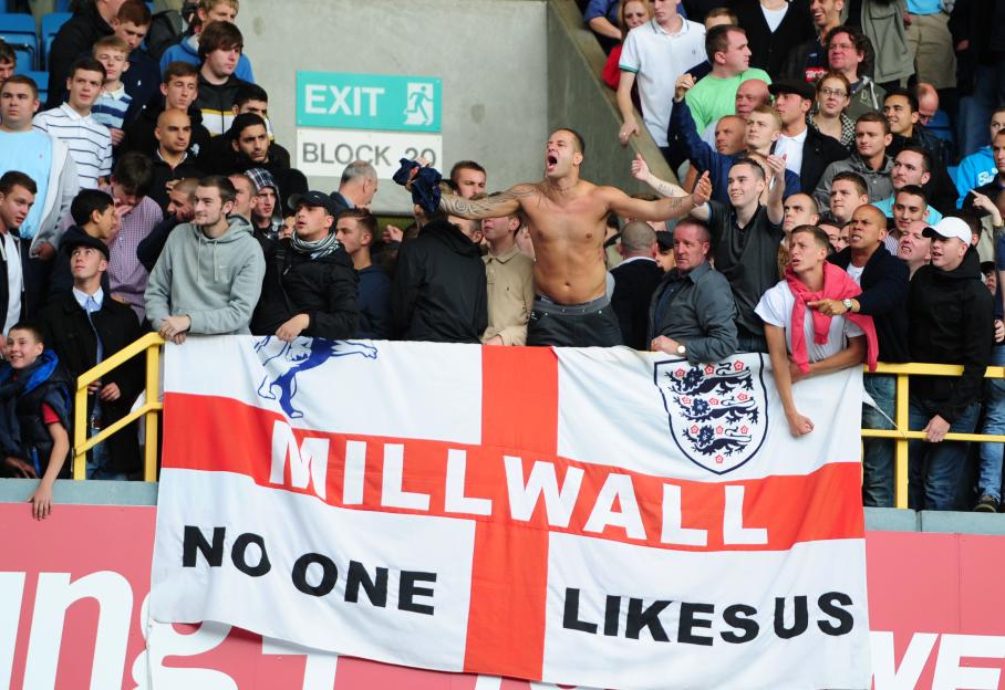 Millwall fans goad the West Ham fans after the game at The Den stadium.