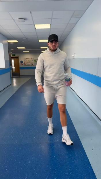 Jordan Brook walking out of the hospital.