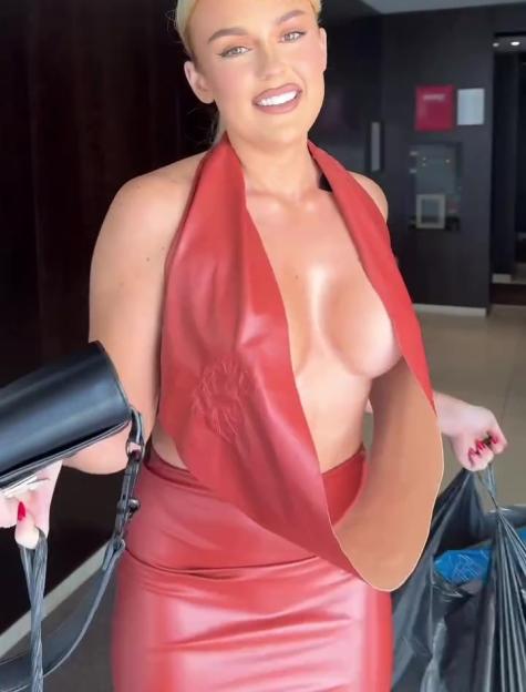 Tallia Storm wearing a red halter dress, holding a black handbag and a trash bag, with text overlay.