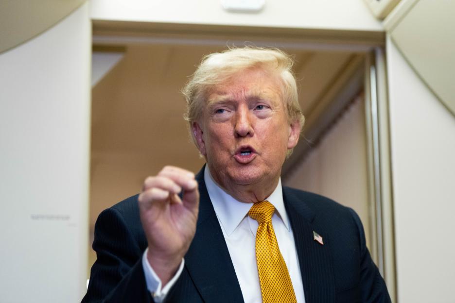 Donald Trump speaking, gesturing with his right hand.