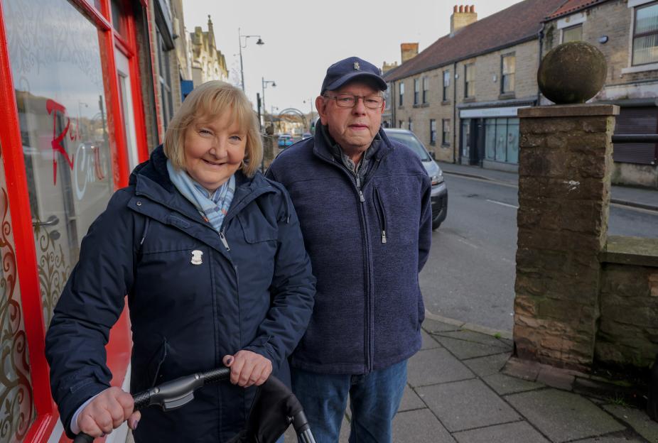 Susan Laing and Paul Martin standing on a street in Shildon Town, known for its cheap properties and unemployment.