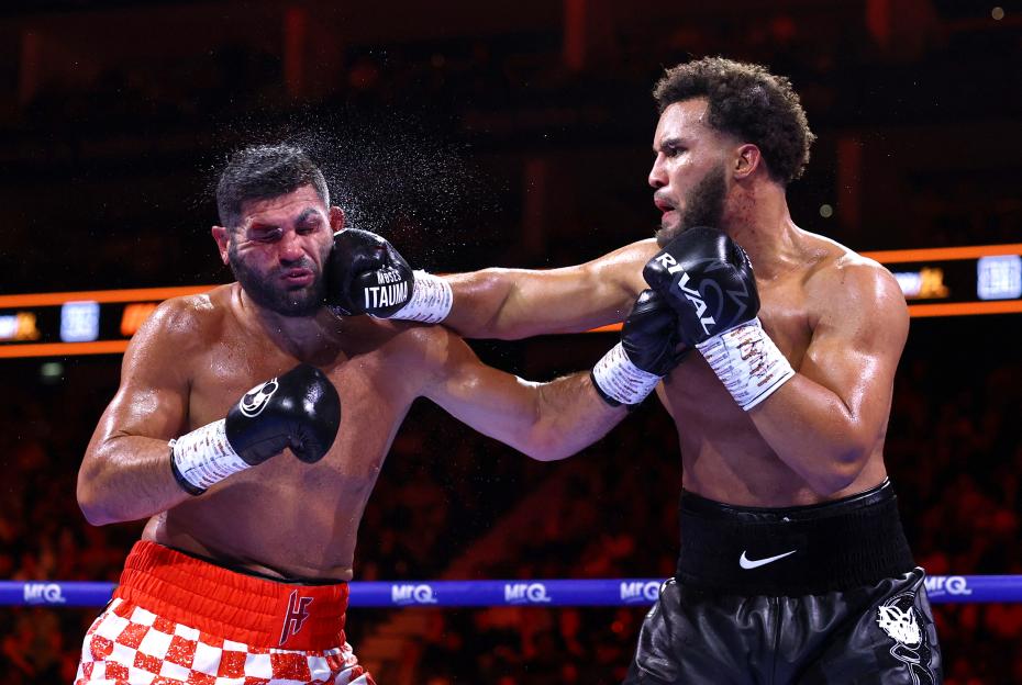 Moses Itauma lands a punch on Filip Hrgovic's face during their IBF World Heavyweight Title fight.