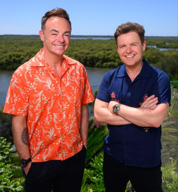 Ant and Dec smiling at the camera on the set of "I'm a Celebrity...Get Me Out Of Here!" in Australia.