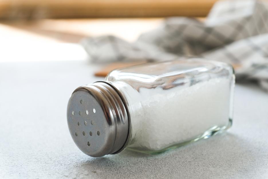 Salt shaker on a kitchen table.
