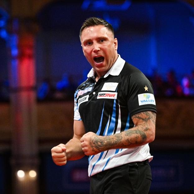 Gerwyn Price celebrating winning a leg in his quarter-final match against Josh Rock.
