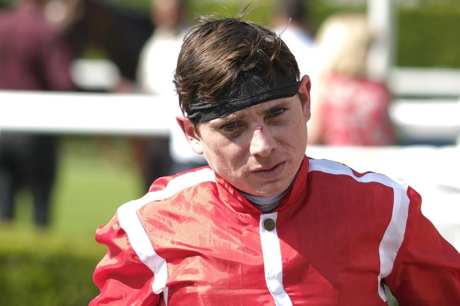 a man wearing a headband and a red jacket