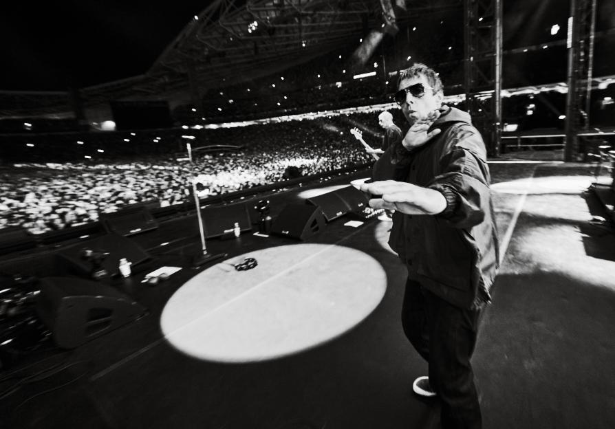 Liam Gallagher performing on stage at the Oasis Live '25 tour.