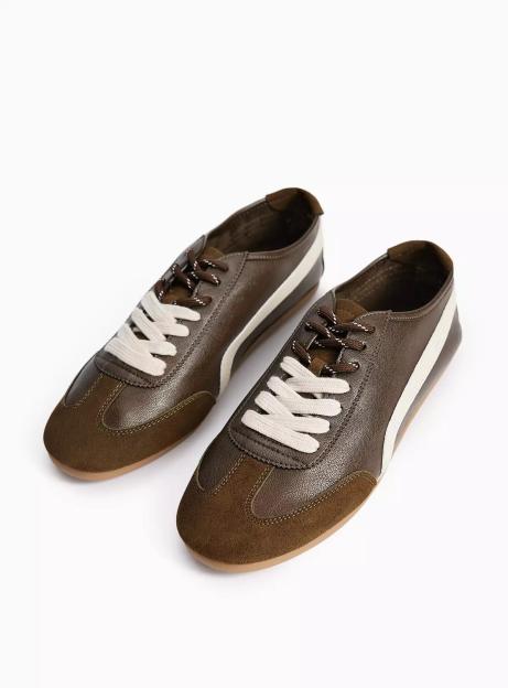 A pair of brown and olive green sneakers with white stripes and white laces.