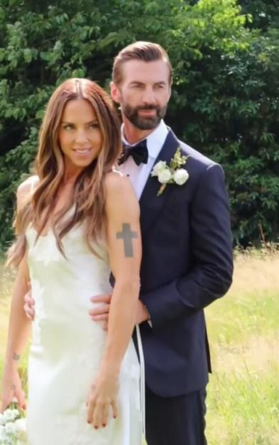 Mel C in a white dress with a groom in a black suit.