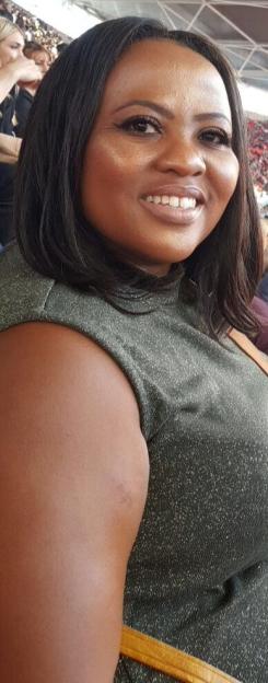 Charmaine Masoeu smiling while wearing a sparkly green top.