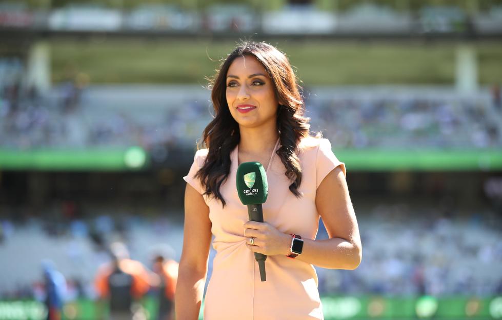 Isa Guha holding a Cricket Australia microphone.