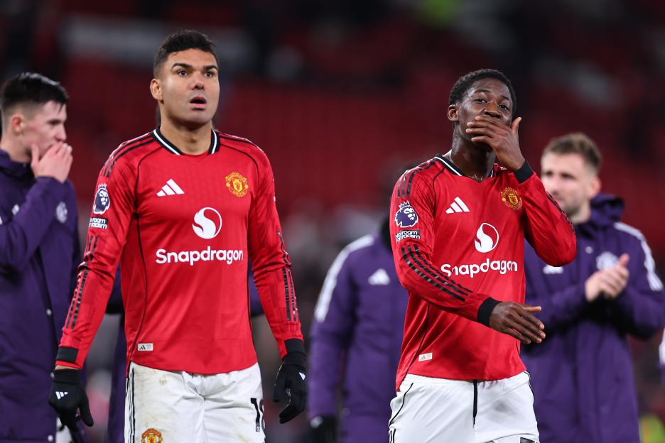 Casemiro and Kobbie Mainoo, Manchester United players, dejected after a soccer match.