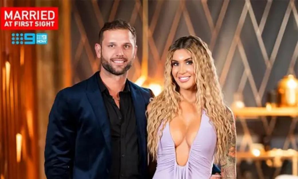A man and a woman from "Married at First Sight" smiling.