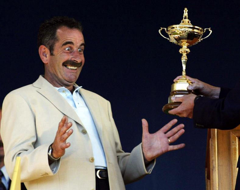 Europe's Ryder Cup team captain Sam Torrance smiling while being presented with the Ryder Cup.