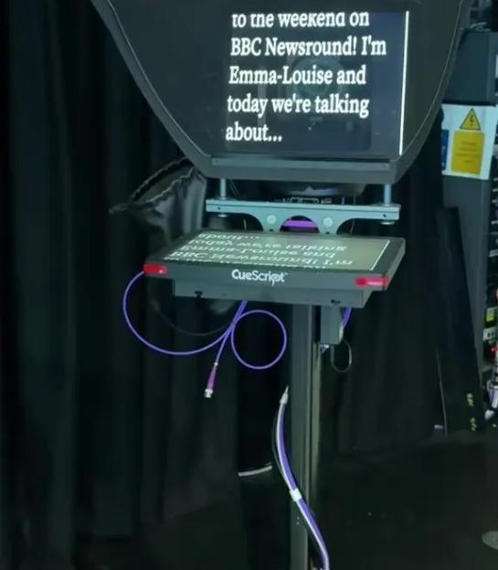 A teleprompter displays a question about a Nintendo controller and a script for a BBC Newsround segment.