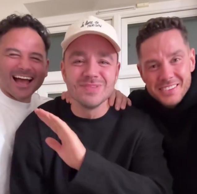 Adam Thomas and two others laughing and smiling.