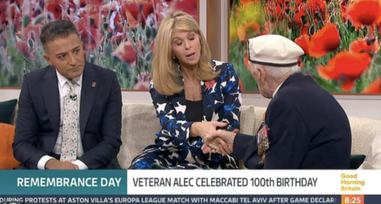 Three people, including a veteran in uniform, on a TV show for Remembrance Day.