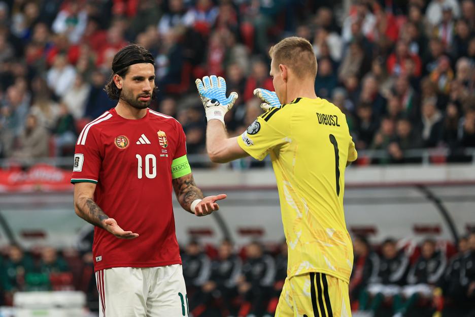 Dominik Szoboszlai in a red jersey with number 10 and Denes Dibusz in a yellow goalkeeper uniform talking during the FIFA World Cup 2026 Qualifiers.