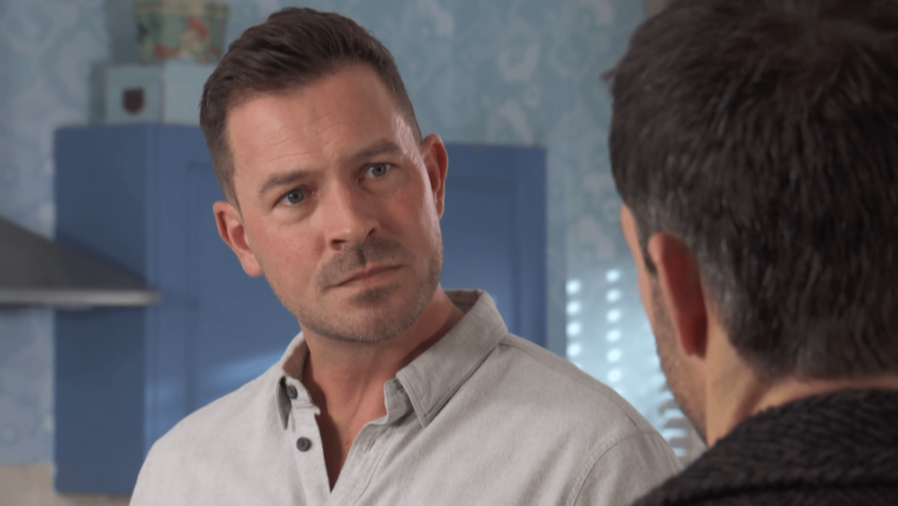 Darren Osborne from Hollyoaks looking seriously at another character.